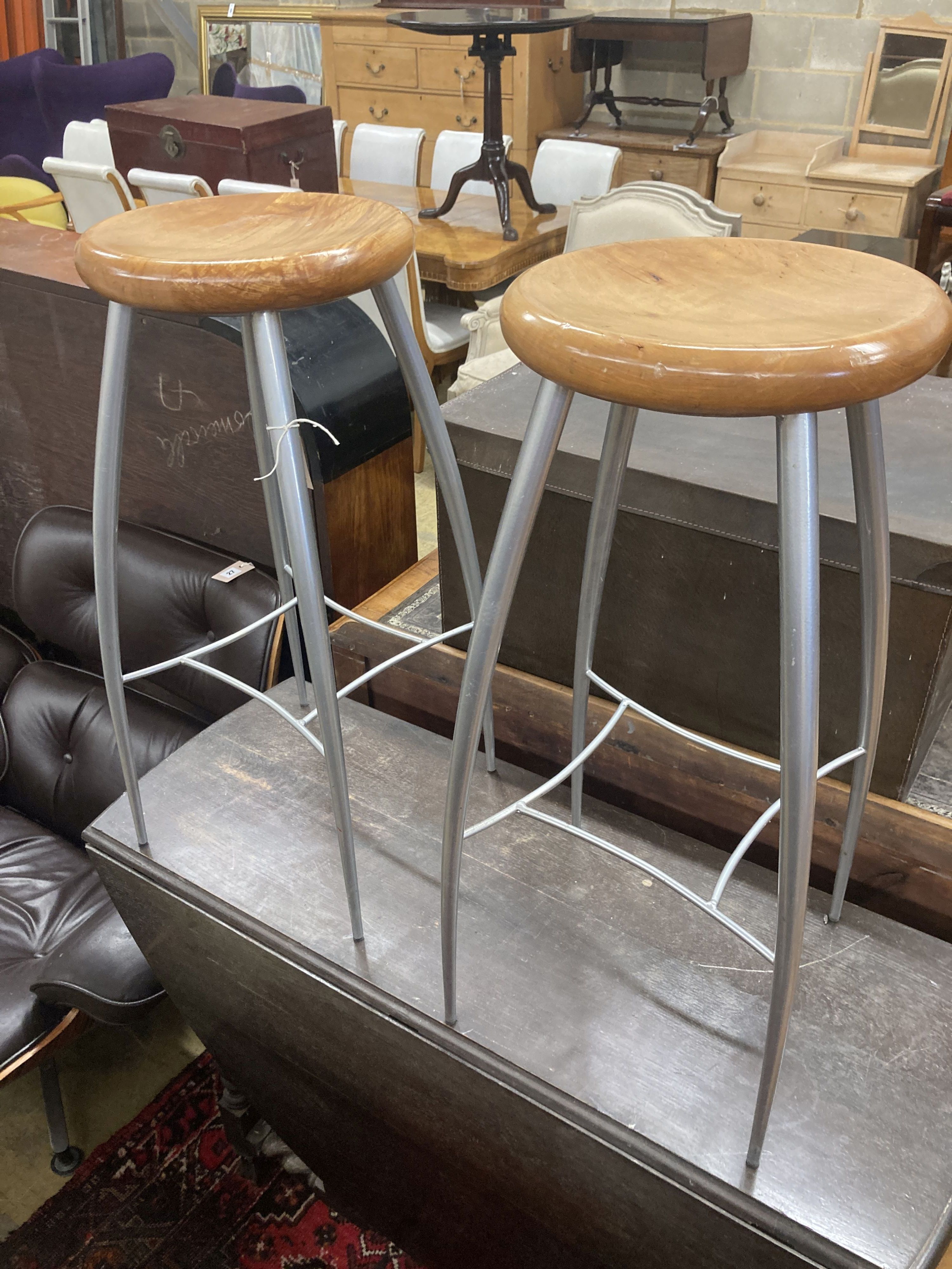A pair of contemporary silvered metal bar stools, height 73cm